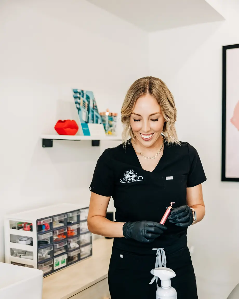 Mandy Neumann preparing a treatment at Sunshine City Med Spa